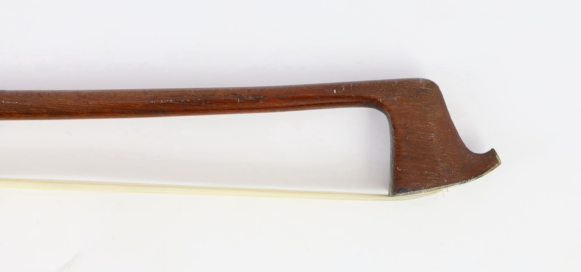 A silver mounted violin bow, stamped DODD, another stamped TOURTE and another bow